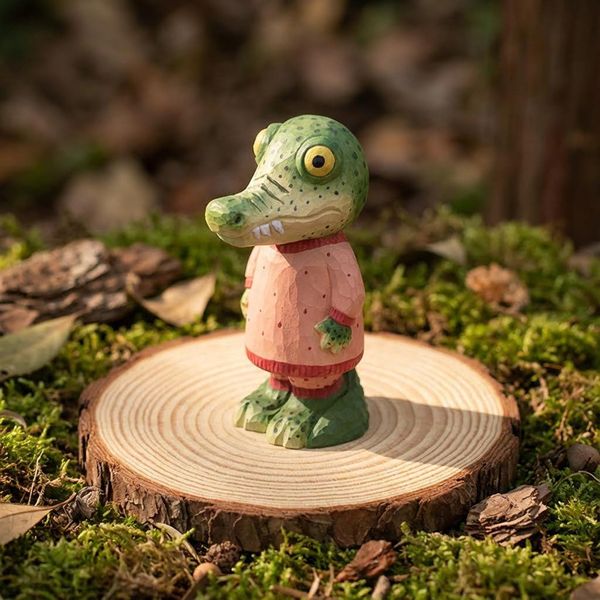 Crocodile in Pink Pyjamas, hand-carved wooden figurine